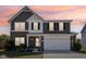 Charming two-story home with a well-manicured lawn, a two-car garage and inviting curb appeal at 9723 Violet Cir, Indianapolis, IN 46239