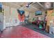 Spacious garage with painted walls, large mirrors, and plenty of space for a home gym and storage at 9723 Violet Cir, Indianapolis, IN 46239