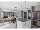 Contemporary kitchen featuring a dining area, white cabinetry, stainless steel appliances, and an open concept layout at 9723 Violet Cir, Indianapolis, IN 46239