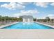 A refreshing community pool surrounded by lounge chairs and greenery, ideal for summer days at 9723 Violet Cir, Indianapolis, IN 46239
