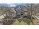 An aerial of a well-kept home shows fresh landscaping and a manicured lawn at 9931 Woodlands Dr, Fishers, IN 46037