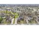 Expansive aerial view showcasing the neighborhood with lush greenery and well-spaced homes at 9931 Woodlands Dr, Fishers, IN 46037