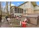 Enjoy this lovely backyard with brick and wood exterior, an enclosed porch, and an outdoor deck at 9931 Woodlands Dr, Fishers, IN 46037