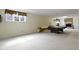Spacious basement featuring a pool table, brick fireplace, and large window at 9931 Woodlands Dr, Fishers, IN 46037