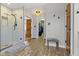 Hallway leading to shower room and walk-in closet with tiled floor at 9931 Woodlands Dr, Fishers, IN 46037