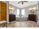 Bathroom with double vanities, large soaking tub and wooden floor at 9931 Woodlands Dr, Fishers, IN 46037