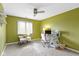 Bright bedroom with ceiling fan, plush carpet, a large window with natural light at 9931 Woodlands Dr, Fishers, IN 46037