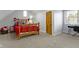 Bedroom with neutral carpet, wooden door and window with desk at 9931 Woodlands Dr, Fishers, IN 46037