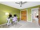 Bedroom with ceiling fan, carpet floor, desk, and a large window with natural light at 9931 Woodlands Dr, Fishers, IN 46037