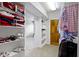 Walk-in closet with custom shelving units and ample storage space for shoes and clothing at 9931 Woodlands Dr, Fishers, IN 46037