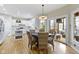 Bright eat-in kitchen features a table with wicker chairs and sliding doors leading to a screened-in porch at 9931 Woodlands Dr, Fishers, IN 46037