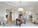 Inviting entryway with neutral tones, elegant chandelier and seamless flow to the living spaces at 9931 Woodlands Dr, Fishers, IN 46037