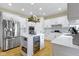 This well-appointed kitchen features an island, stainless steel appliances, and plenty of counter space and storage at 9931 Woodlands Dr, Fishers, IN 46037
