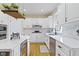 Bright kitchen featuring white cabinetry, stainless steel appliances, and a modern faucet design, ideal for cooking enthusiasts at 9931 Woodlands Dr, Fishers, IN 46037