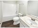 Clean bathroom featuring a shower-tub, a sink with a modern faucet, and a white toilet at 10453 Apple Creek Dr, Indianapolis, IN 46235