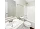 Bathroom with white vanity, toilet and tub at 10453 Apple Creek Dr, Indianapolis, IN 46235