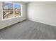 Simple bedroom with carpet, a window, and neutral walls at 10453 Apple Creek Dr, Indianapolis, IN 46235