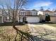 Well-maintained two-story home with a two-car garage and a welcoming front porch at 10453 Apple Creek Dr, Indianapolis, IN 46235
