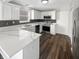Modern kitchen featuring stainless steel appliances, stone countertops, and white cabinets at 10453 Apple Creek Dr, Indianapolis, IN 46235