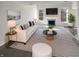 Bright living room featuring large windows, a fireplace, and modern decor at 10453 Apple Creek Dr, Indianapolis, IN 46235