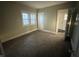 Comfortable bedroom with new carpet, neutral walls, and natural light at 1124 Victory Ct, Anderson, IN 46016