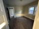 Bright bedroom featuring neutral walls, carpet, and window with natural light at 1124 Victory Ct, Anderson, IN 46016