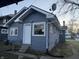 Charming one-story home with grey siding, a white door, and a well-maintained lawn at 1124 Victory Ct, Anderson, IN 46016