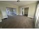 Open living space with new carpeting, neutral tones, and natural light at 1124 Victory Ct, Anderson, IN 46016
