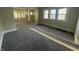 Bright living area featuring new carpeting, neutral paint, and an open floor plan at 1124 Victory Ct, Anderson, IN 46016