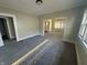 Cozy living room with new carpeting, neutral walls, and natural light streaming through windows at 1124 Victory Ct, Anderson, IN 46016