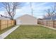 A backyard view shows a grass lawn and wood fence at 1331 N Grant Ave, Indianapolis, IN 46201