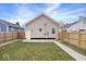 A backyard view shows a grass lawn and wood fence at 1331 N Grant Ave, Indianapolis, IN 46201