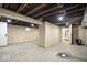 Partially finished basement with concrete floor and some panelled walls at 1331 N Grant Ave, Indianapolis, IN 46201