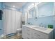 Well-lit bathroom with double vanity, modern fixtures, and ample storage at 1331 N Grant Ave, Indianapolis, IN 46201