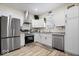 Bright kitchen featuring stainless steel appliances, white cabinetry, and stylish countertops at 1331 N Grant Ave, Indianapolis, IN 46201