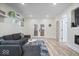 Spacious living room featuring a modern fireplace, plush seating, and ample natural light at 1331 N Grant Ave, Indianapolis, IN 46201
