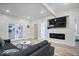 Open-concept living space with modern fireplace, comfortable seating, and lots of natural light at 1331 N Grant Ave, Indianapolis, IN 46201