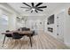 Open-concept living space with modern fireplace, comfortable seating, open kitchen, and dining area at 1331 N Grant Ave, Indianapolis, IN 46201
