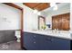 Bathroom with double sinks, vanity with granite countertop, and modern fixtures at 1529 N Alabama N St # B, Indianapolis, IN 46202