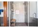 Modern bathroom featuring a glass-enclosed shower with bench and grey and white marble tile at 1529 N Alabama N St # B, Indianapolis, IN 46202