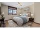Sunlit bedroom with stylish decor, comfortable bed, and a scenic neighborhood view at 1529 N Alabama N St # B, Indianapolis, IN 46202