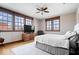 Light-filled bedroom with large windows, a flat-screen TV, and a relaxing atmosphere at 1529 N Alabama N St # B, Indianapolis, IN 46202