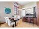 Bright dining area featuring a large window and an open view to the kitchen at 1529 N Alabama N St # B, Indianapolis, IN 46202