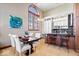 Dining area with modern lighting that adjoins a kitchen with counter seating at 1529 N Alabama N St # B, Indianapolis, IN 46202