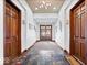 Hallway with neutral walls, unit doors, and an exit door to the exterior at 1529 N Alabama N St # B, Indianapolis, IN 46202