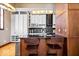 Modern kitchen featuring dark countertops, bar stool seating, and stainless steel appliances at 1529 N Alabama N St # B, Indianapolis, IN 46202