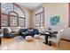 Hardwood floors, open plan living space, big windows, comfortable sofa, and well-lit for easy living at 1529 N Alabama N St # B, Indianapolis, IN 46202