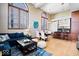 Open-concept living room boasts modern decor, tall windows, hardwood floors and adjoins the kitchen at 1529 N Alabama N St # B, Indianapolis, IN 46202