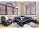 Well-lit living area showcasing hardwood floors, large windows, and a comfortable seating arrangement at 1529 N Alabama N St # B, Indianapolis, IN 46202