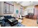 Open-concept living room boasts modern decor, tall windows, hardwood floors and adjoins the kitchen at 1529 N Alabama N St # B, Indianapolis, IN 46202